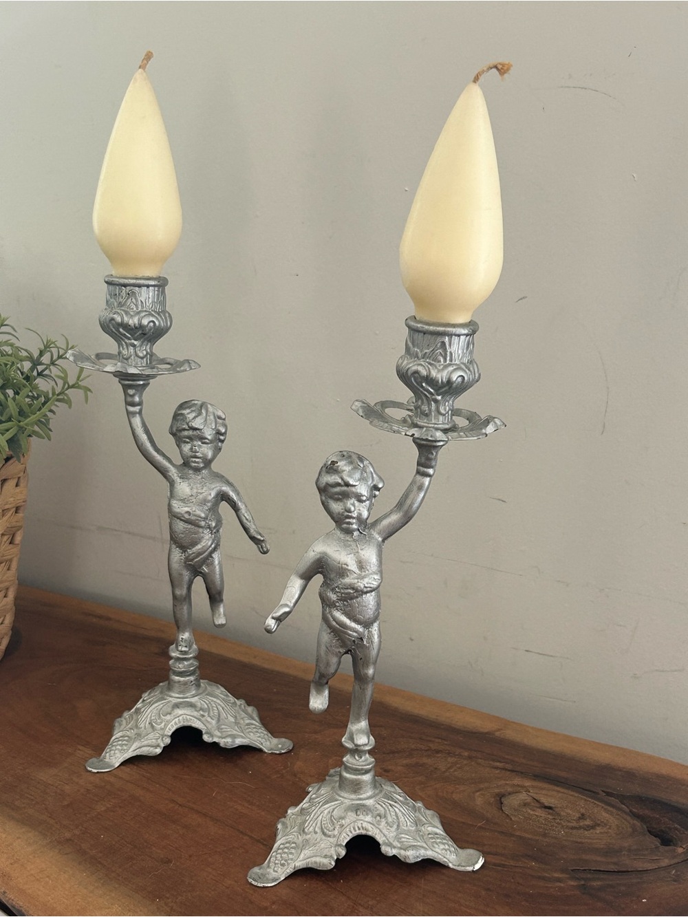 Vintage Metal cherubs Candleholders holding candlestick’s silver / bronze